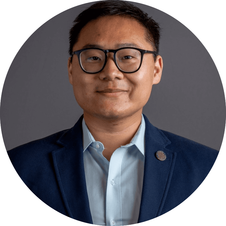 Andrew Ly in a navy suit